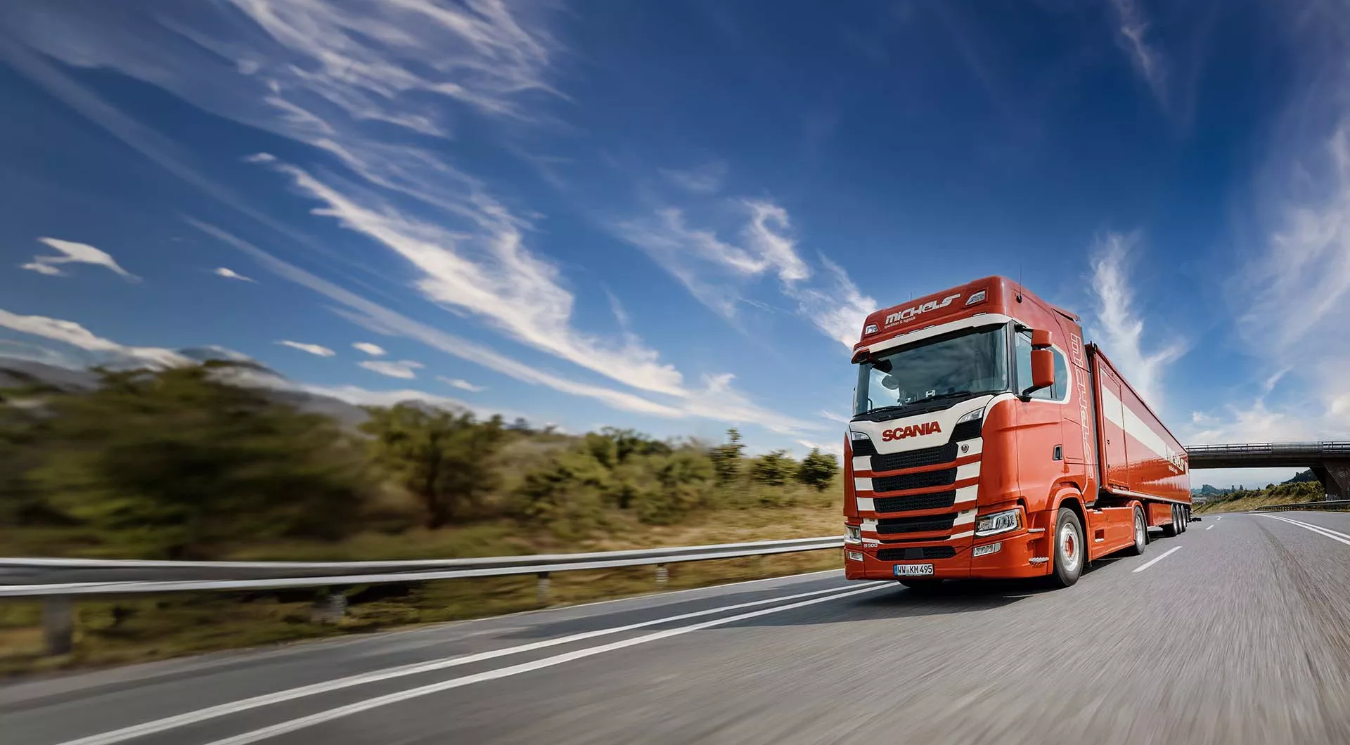 Red truck country road logistics