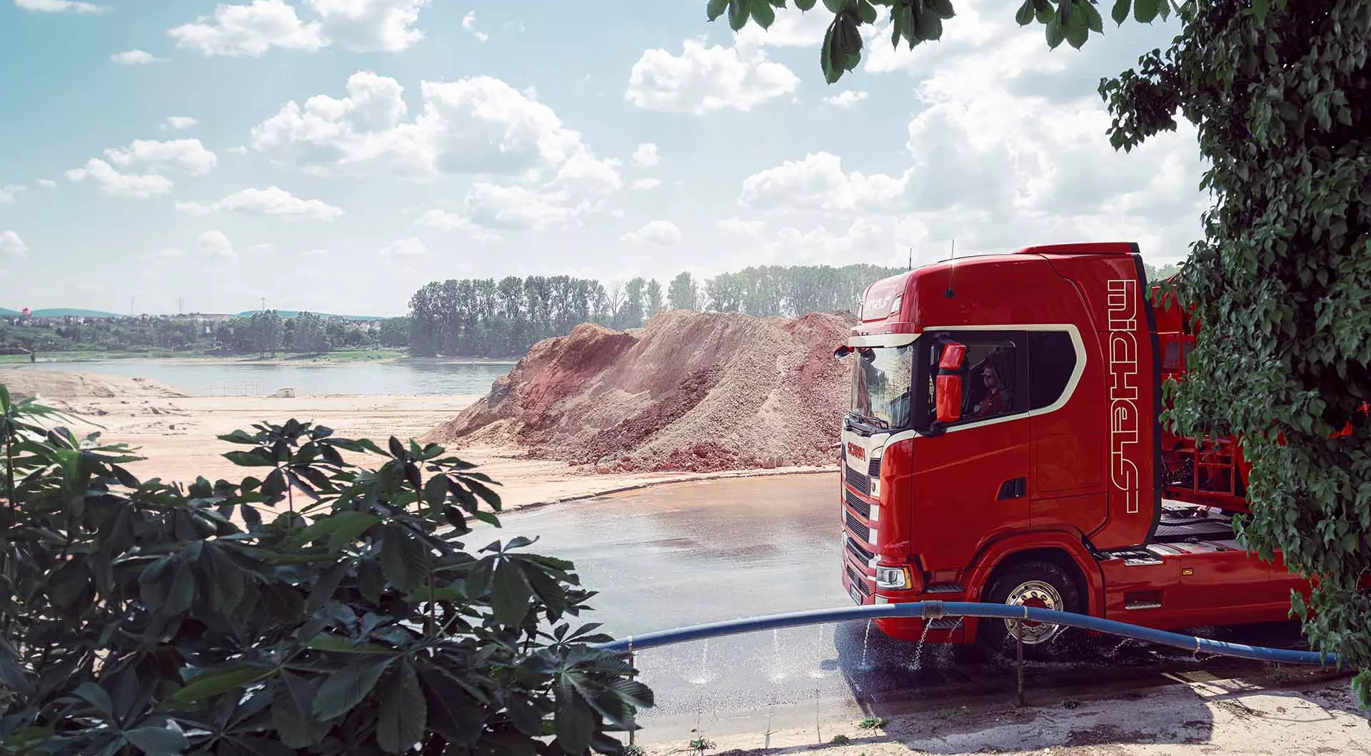 Truck wheels are washed on construction site